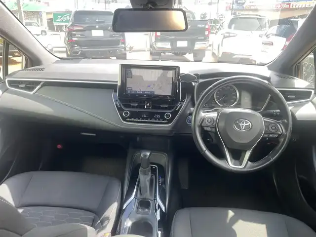 トヨタ カローラ スポーツ ハイブリッドG 三重県 2019(令1)年 6.7万km ブラッキッシュアゲハガラスフレーク 純正9インチメモリナビ（NSZT-Y68T)/　＊フルセグテレビ/Bluetooth/FM/AM/バックカメラ/セーフティセンス/3灯式LEDヘッドランプ/オートライト/ボディ同色電動格納ドアミラー/205/55R16タイヤ/　＊16インチアルミホイール/革巻きステアリングホイール/左右独立温度調整オートエアコン/ブラックファブリックシート/スポーツシート/スマートエントリー/プッシュスタート