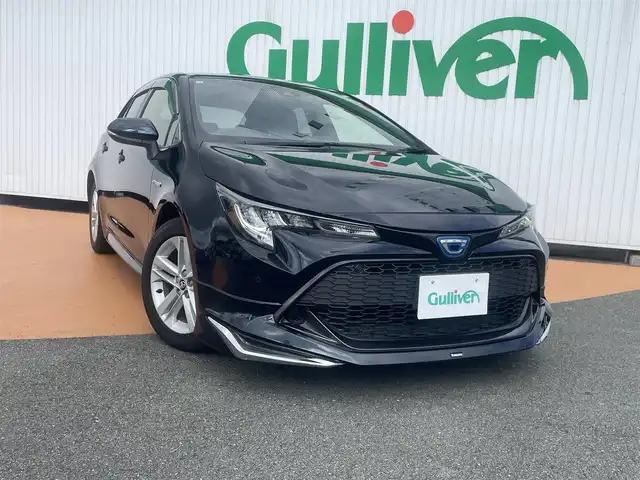 トヨタ カローラ スポーツ ハイブリッドG 三重県 2019(令1)年 6.7万km ブラッキッシュアゲハガラスフレーク 純正9インチメモリナビ（NSZT-Y68T)/　＊フルセグテレビ/Bluetooth/FM/AM/バックカメラ/セーフティセンス/3灯式LEDヘッドランプ/オートライト/ボディ同色電動格納ドアミラー/205/55R16タイヤ/　＊16インチアルミホイール/革巻きステアリングホイール/左右独立温度調整オートエアコン/ブラックファブリックシート/スポーツシート/スマートエントリー/プッシュスタート