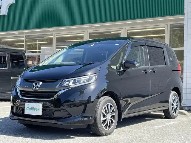 ホンダ フリード G ホンダセンシング 岐阜県 2019(令1)年 0.7万km プレミアムスパークルブラックパール ワンオーナー/4WD/社外SDナビ/【Bluetooth．CD.DVD.AM/FM．TV.AUX】/両側パワースライドドア/衝突軽減ブレーキ/レーンキープアシスト/バックカメラ/クルーズコントロール/シートヒーター/スマートキー/LEDヘッドライト・オート機能付き/ウォークスルー/ETC/ドライブレコーダー/純正フロアマット/ドアバイザー/ウィンカーミラー/アイドリングストップ/スペアキー/保証書/取扱説明書