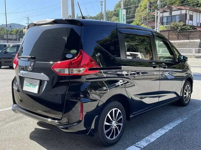 ホンダ フリード G ホンダセンシング 岐阜県 2019(令1)年 0.7万km プレミアムスパークルブラックパール ワンオーナー/4WD/社外SDナビ/【Bluetooth．CD.DVD.AM/FM．TV.AUX】/両側パワースライドドア/衝突軽減ブレーキ/レーンキープアシスト/バックカメラ/クルーズコントロール/シートヒーター/スマートキー/LEDヘッドライト・オート機能付き/ウォークスルー/ETC/ドライブレコーダー/純正フロアマット/ドアバイザー/ウィンカーミラー/アイドリングストップ/スペアキー/保証書/取扱説明書