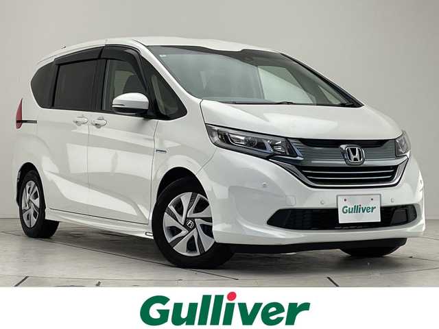 ホンダ フリード ハイブリット G ホンダセンシング 愛知県 2017(平29)年 6.5万km ホワイトオーキッドパール ホンダセンシング/両側パワースライドドア/純正9型ナビ　SDカードなし/バックカメラ/レーダークルーズコントロール/ETC/ドライブレコーダー/衝突軽減システム/フルセグ/CD DVD/Bluetooth/ステアリングスイッチ/スマートキー/プッシュスタート