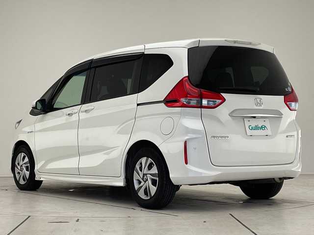 ホンダ フリード ハイブリット G ホンダセンシング 愛知県 2017(平29)年 6.5万km ホワイトオーキッドパール ホンダセンシング/両側パワースライドドア/純正9型ナビ　SDカードなし/バックカメラ/レーダークルーズコントロール/ETC/ドライブレコーダー/衝突軽減システム/フルセグ/CD DVD/Bluetooth/ステアリングスイッチ/スマートキー/プッシュスタート