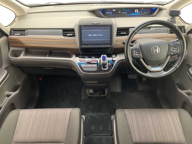 ホンダ フリード ハイブリット G ホンダセンシング 愛知県 2017(平29)年 6.5万km ホワイトオーキッドパール ホンダセンシング/両側パワースライドドア/純正9型ナビ　SDカードなし/バックカメラ/レーダークルーズコントロール/ETC/ドライブレコーダー/衝突軽減システム/フルセグ/CD DVD/Bluetooth/ステアリングスイッチ/スマートキー/プッシュスタート