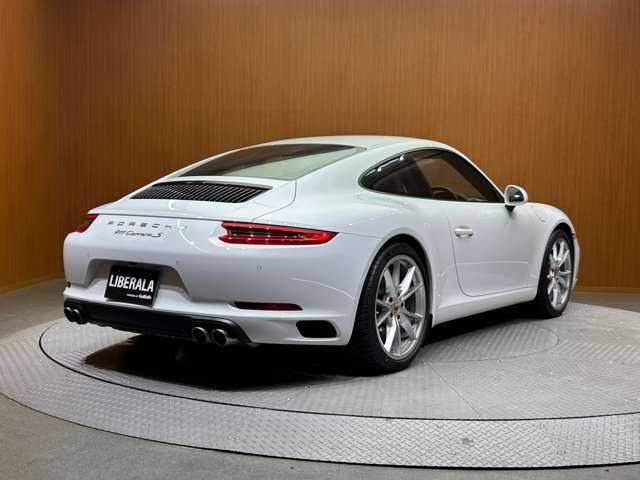 ポルシェ ９１１ カレラS 千葉県 2018(平30)年 2.2万km 白 スポーツクロノＰＫＧ　/純正ナビ　/バックカメラ　/ブラックレザーシート　/シートヒーター　/パワーシート　/キセノンヘッドライト　/オートライト　/ＥＴＣ　/純正２０インチＡＷ　/パドルシフト　/レッドキャリパー