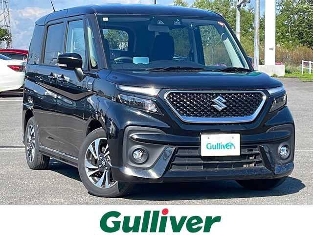 スズキ ソリオ バンディット HV MV 道央・札幌 2024(令6)年 2.1万km スーパーブラックパール ４WD/社外メモリーナビ/AM/FM/BT/デュアルカメラブレーキサポート/横滑り防止装置/レーダークルーズコントロール/レーンキープアシスト/リヤパーキングセンサー/バックカメラ/ETC/ドライブレコーダー/アイドリングストップ/HUD/両側パワースライドドア/前席シートヒーター/革巻きステアリング/ステアリングリモコン/プッシュスタート/スマートキー/LEDヘッドライト/オートライト/オートハイビーム/フォグランプ/電動格納ミラー/ヒーテッドドアミラー/ウィンカーミラー/フロアマット/スペアキー/レンタカー登録