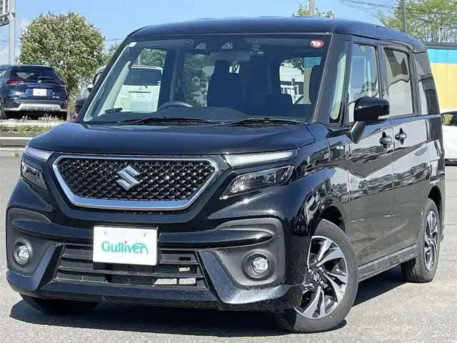 スズキ ソリオ バンディット HV MV 道央・札幌 2024(令6)年 2.1万km スーパーブラックパール ４WD/社外メモリーナビ/AM/FM/BT/デュアルカメラブレーキサポート/横滑り防止装置/レーダークルーズコントロール/レーンキープアシスト/リヤパーキングセンサー/バックカメラ/ETC/ドライブレコーダー/アイドリングストップ/HUD/両側パワースライドドア/前席シートヒーター/革巻きステアリング/ステアリングリモコン/プッシュスタート/スマートキー/LEDヘッドライト/オートライト/オートハイビーム/フォグランプ/電動格納ミラー/ヒーテッドドアミラー/ウィンカーミラー/フロアマット/スペアキー/レンタカー登録