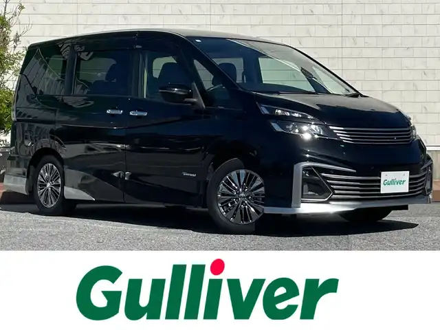 日産 セレナ ライダー プロパイロット E 滋賀県 2017(平29)年 2.1万km ダイヤモンドブラック 社外エアロ/社外フロントグリル/両側パワースライドドア/フリップダウンモニター/純正9インチナビ【MM516D-L】/（AM/FM/フルセグ/CD/DVD/Bluetooth）/バックカメラ/ETC/ドライブレコーダー/スタッドレスタイヤ積込/踏み間違い防止アシスト/ブレーキアシスト/プリクラッシュブレーキアシスト/ヒルスタート（坂道発進）アシスト/前方衝突防止支援システム/TCS（トラクションコントロールシステム）/VDC（ビークルダイナミクスコントロール）/レーンキープアシスト/車間自動制御システム	/ASCD（オートスピードコントロール装置）/ABS（アンチロックブレーキシステム）/コーナー・バックセンサー（ソナー）/標識検知機能/電動格納ミラー/電子パーキング/ブレーキホールド/ステアリングスイッチ/オートライト/LEDヘッドライト/フロントフォグ/フルオートエアコン/プッシュスタート/スマートキー/純正フロアマット/純正ドアバイザー
