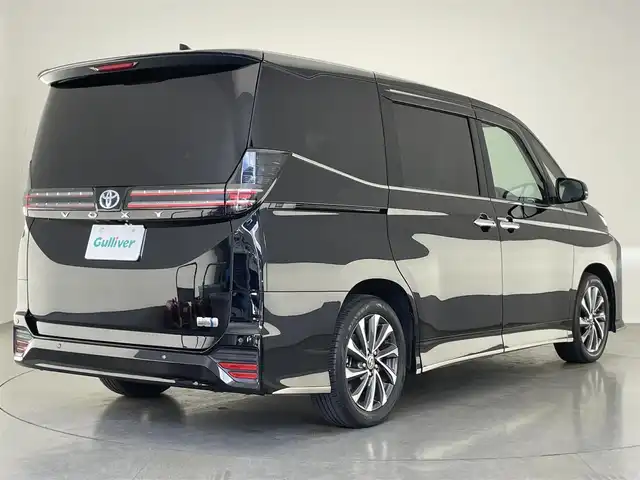 トヨタ ヴォクシー ハイブリッド S－Z 愛知県 2023(令5)年 2万km アティチュードブラックマイカ 純正１０．５型ナビ　快適利便Ｈｉgh　禁煙車　フルセグＴＶ　ＤＶＤデッキ　バックカメラ　ハーフレザー　シートヒーター　パワーバックドア　ＡＣ１００Ｖ　モデリスタシグネチャーイルミ　前後ドラレコ　衝突軽減　シートカバー　セーフティセンス　車線逸脱　モデリスタLEDグリル　LEDオートライト　オートハイビーム　ナノイーXエアコン　コーナーセンサー　クリアランスソナー　電動パーキング