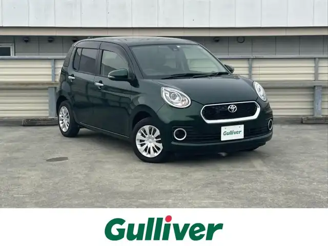 トヨタ パッソ モーダ　S 静岡県 2018(平30)年 2.4万km ブラックマイカメタリック/ダークエメラルドマイカ 2トーン プッシュスタート/社外メモリナビ（AM/FM/CD/DVD/TV/Bluetooth）/バックカメラ/ETC/横滑り防止装置/オートライト/アイドリングストップ/AAC/コーナーセンサー