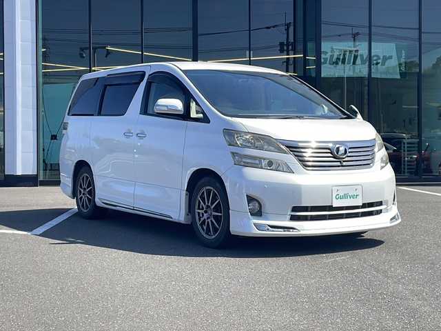 トヨタ ヴェルファイア 2．4V 鹿児島県 2008(平20)年 12万km ホワイトパールクリスタルシャイン 純正ナビ/CD/DVD/TV/ワンセグTV/3列シート/パワーステアリング/パワーウィンドウ/両側パワースライドドア/パーキングアシスト/アイドリングストップ/純正後部座席モニター/ETC/純正フロアマット/ABS/コーナーセンサー/オートライト