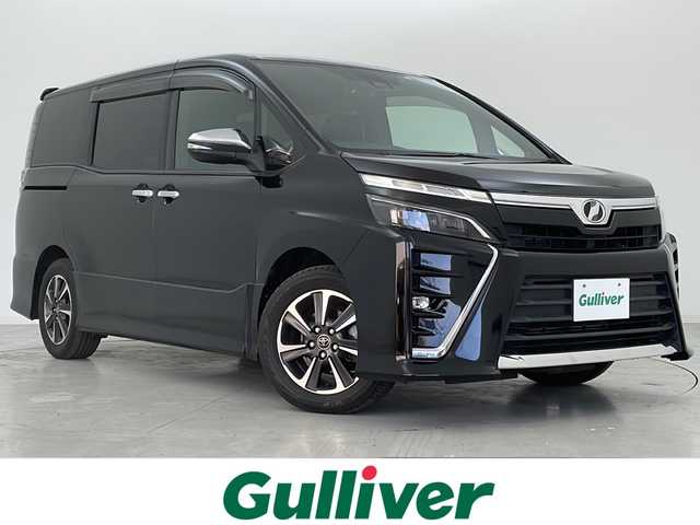 トヨタ ヴォクシー ZS 煌 宮城県 2018(平30)年 5.6万km ブラック 禁煙車/トヨタセーフティセンス/・プリクラッシュセーフティ/・レーンディパーチャーアラート/・オートハイビーム/純正10インチナビ/・CD.DVD.SD.BT/フルセグTV/バックモニター/両側パワースライドドア/LEDヘッドライト/フォグランプ/純正ドライブレコーダー/ビルトインETC/アイドリングストップ/横滑り防止装置/ステアリングスイッチ/プッシュスタート/スマートキー/純正16インチアルミホイール/社外フロアマット/後席ロールサンシェード/シートバックテーブル