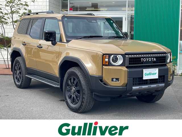 トヨタ ランドクルーザー ２５０ VX ファーストエディション 青森県 2024(令6)年 0.1万km未満 茶 4WD/純正12.3型DAナビ・フルセグTV/JBLプレミアムサウンド/Bluetooth・USB・HDMI・ミラキャスト/パノラミックビューモニター/ムーンルーフ/茶革シート/前席ベンチレーション・ヒーター/運転席パワーシート/ステアリングヒーター/デジタルインナーミラー/おくだけ充電/パワーバックドア/セーフティセンス/トヨタチームメイト/プリクラッシュセーフティ/レーダークルーズコントロール/レーントレーシングアシスト/レーンディパーチャーアラート/オートマチックハイビーム/ブラインドスポットモニター/純正前後ドライブレコーダー/1～3列目充電用USB端子/純正ファーストエディションフロアマット/OP丸目LEDヘッドランプ/LEDフォグランプ/LEDリアフォグランプ/OP純正ヒッチメンバー/ブラックルーフレール/純正18インチアルミ