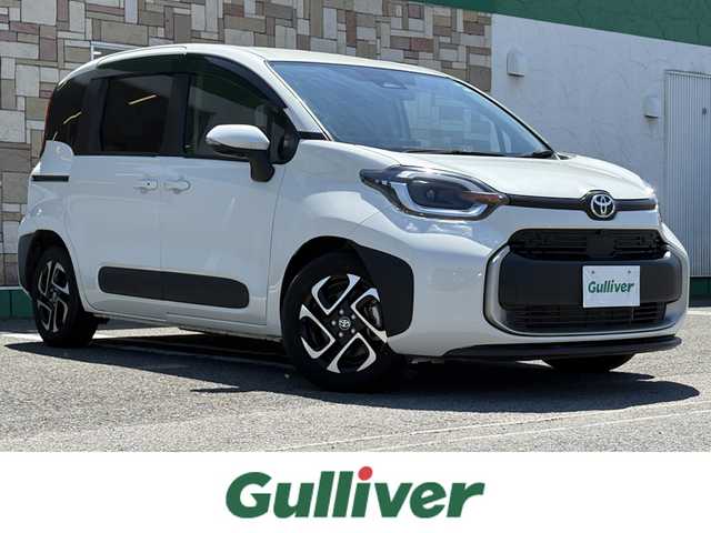 トヨタ シエンタ Z 徳島県 2023(令5)年 1.4万km ホワイトパールクリスタルシャイン メーカー10.5型ナビ/（ラジオ/BT/USB/フルセグ）/純正フリップダウンモニター/バックカメラ/全方位カメラ/両側電動スライドドア/ビルトインETC/前後ドライブレコーダー/コーナーセンサー/ブラインドスポットモニター/PKSB/DRIVEMODE/追従式クルーズコントロール/LEDヘッドライト/新車時保証書