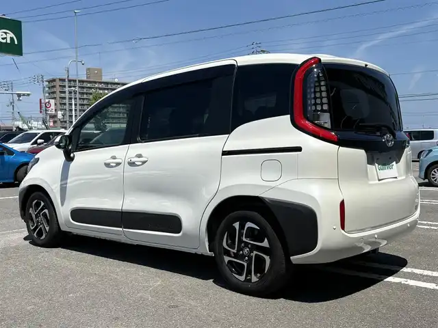 トヨタ シエンタ Z 徳島県 2023(令5)年 1.4万km ホワイトパールクリスタルシャイン メーカー10.5型ナビ/（ラジオ/BT/USB/フルセグ）/純正フリップダウンモニター/バックカメラ/全方位カメラ/両側電動スライドドア/ビルトインETC/前後ドライブレコーダー/コーナーセンサー/ブラインドスポットモニター/PKSB/DRIVEMODE/追従式クルーズコントロール/LEDヘッドライト/新車時保証書