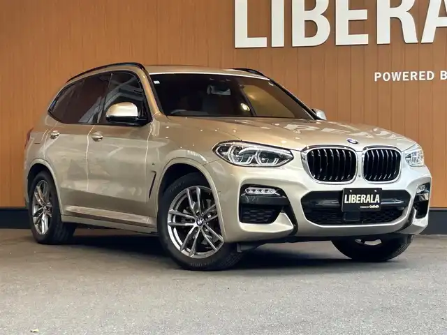 ＢＭＷ Ｘ３ xDrive20d Mスポーツ 宮城県 2018(平30)年 4.4万km ゴールド BMW Individualボディカラー：サン・ストーン（C1N）/セレクトパッケージ/　・電動パノラマガラスサンルーフ/　・リヤサイドウインドーローラーブラインド/　・harman/kardonサラウンドサウンドシステム/ハイラインパッケージ/　・ランバーサポート（D/N席）/　・リヤシートヒーティング/　・ヴァーネスカレザーシート/　・ポプラグレーファインウッドインテリアトリム/アクティブクルーズコントロール/レーンキープアシスト/ブラインドスポットモニター/ヘッドアップディスプレイ/iDriveナビゲーションシステム/フルセグTV/トップビューカメラ/純正19インチAW/コンフォートアクセス/パワーバックドア