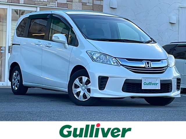 ホンダ フリード G プレミアムエディション 徳島県 2016(平28)年 4.1万km ホワイトオーキッドパール 純正7インチSDナビ/（Bluetooth/フルセグ/CD/DVD）/バックカメラ/純正フリップダウンモニター/両側パワースライドドア/クルーズコントロール/黒半革シート/HIDヘッドライト/オートライト/ビルトインETC/純正フロアマット/電格ミラー/ドアバイザー/スマートキー