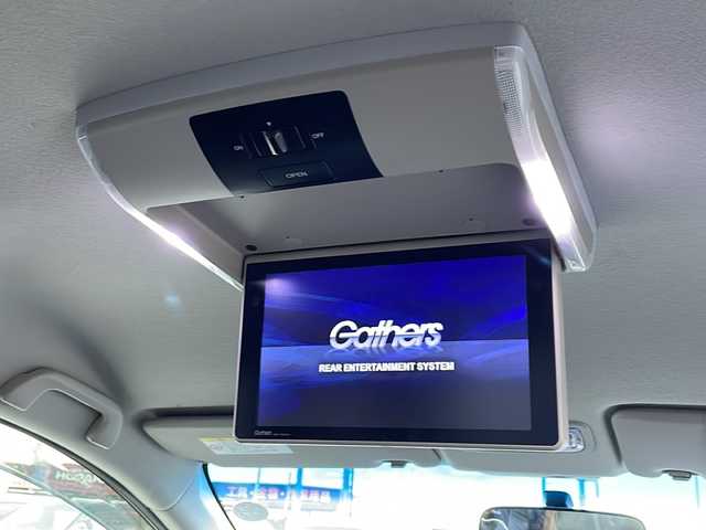 ホンダ フリード G プレミアムエディション 徳島県 2016(平28)年 4.1万km ホワイトオーキッドパール 純正7インチSDナビ/（Bluetooth/フルセグ/CD/DVD）/バックカメラ/純正フリップダウンモニター/両側パワースライドドア/クルーズコントロール/黒半革シート/HIDヘッドライト/オートライト/ビルトインETC/純正フロアマット/電格ミラー/ドアバイザー/スマートキー