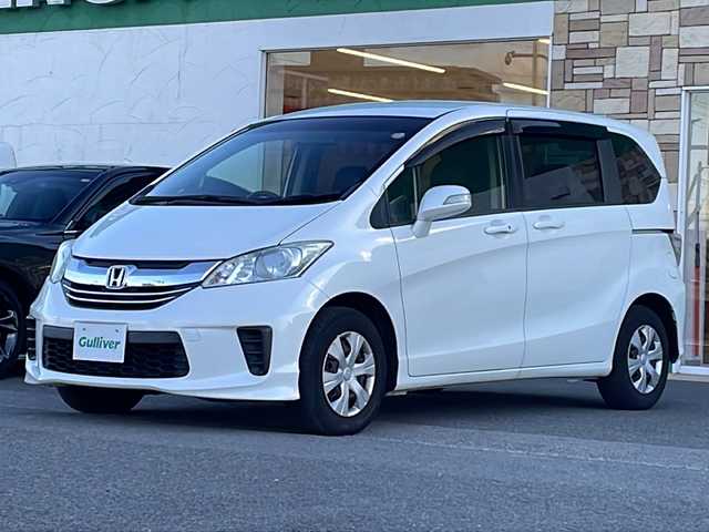 ホンダ フリード G プレミアムエディション 徳島県 2016(平28)年 4.1万km ホワイトオーキッドパール 純正7インチSDナビ/（Bluetooth/フルセグ/CD/DVD）/バックカメラ/純正フリップダウンモニター/両側パワースライドドア/クルーズコントロール/黒半革シート/HIDヘッドライト/オートライト/ビルトインETC/純正フロアマット/電格ミラー/ドアバイザー/スマートキー