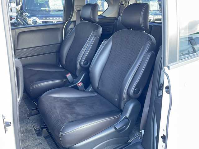 ホンダ フリード G プレミアムエディション 徳島県 2016(平28)年 4.1万km ホワイトオーキッドパール 純正7インチSDナビ/（Bluetooth/フルセグ/CD/DVD）/バックカメラ/純正フリップダウンモニター/両側パワースライドドア/クルーズコントロール/黒半革シート/HIDヘッドライト/オートライト/ビルトインETC/純正フロアマット/電格ミラー/ドアバイザー/スマートキー