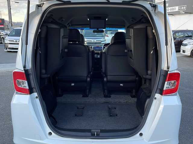 ホンダ フリード G プレミアムエディション 徳島県 2016(平28)年 4.1万km ホワイトオーキッドパール 純正7インチSDナビ/（Bluetooth/フルセグ/CD/DVD）/バックカメラ/純正フリップダウンモニター/両側パワースライドドア/クルーズコントロール/黒半革シート/HIDヘッドライト/オートライト/ビルトインETC/純正フロアマット/電格ミラー/ドアバイザー/スマートキー