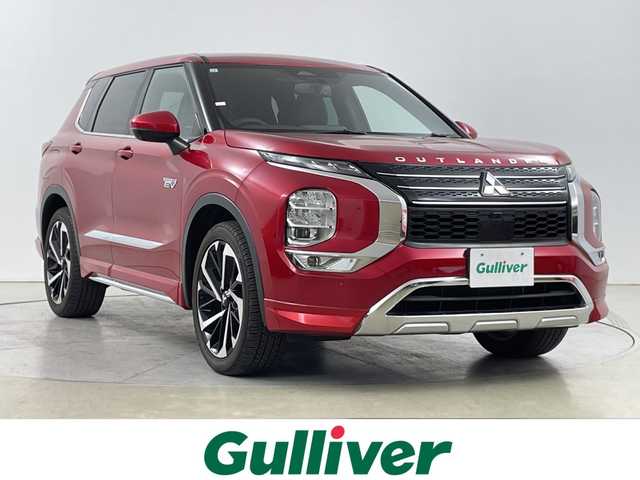 三菱 アウトランダー ＰＨＥＶ P 道央・札幌 2021(令3)年 0.9万km レッドダイヤモンド ・４WD/プラグインHV/BOSEサウンド/・純正スマホ連携ナビ/フルセグTV/・マルチアラウンドモニター/・レーダークルーズコントロール/・衝突被害軽減ブレーキシステム/・踏み間違い衝突防止アシスト/・車線逸脱警報システム/車線逸脱防止支援機能/・ふらつき警報/前方衝突予測警報/標識認識システム/・後側方衝突被害防止支援システム/・後側方車両検知警報システム/後退時車両検知警報システム/・ハンズフリーパワーバックドア/・セミアニリン本革シート/・全席シートヒーター/メモリーPシート/・LEDヘッドランプ/LEDフロントフォグランプ/・LEDデイタイムランニングランプ/・純正20インチアルミホイール/・革巻きステアリングホイール/・ワイヤレス充電/USBポート/・ステアリングヒーター/・左右後席独立温度調整オートエアコン