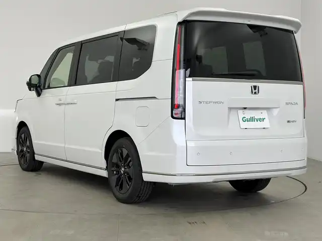 ホンダ ステップワゴン スパーダ eHEV 愛知県 2025(令7)年 0.1千km プラチナホワイトパール 登録済み未使用車/ホンダセンシング/純正11.4インチHONDA　CONNECTナビ/・Bluetooth/・CD/DVD/・AppleCarPlay/・フルセグTV/バックカメラ/ハーフレザー/シートヒーター/電動リアゲード/両側パワースライドドア/格納シート/革巻きステアリング/ステアリングリモコン/純正LEDライト/ディライト/フォグランプ/コーナリングライト/オットマン/純正16インチAW/パドルシフト