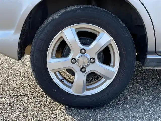 ホンダ フィット 1．3A 新潟県 2005(平17)年 8.5万km ストームシルバーメタリック 4WD/CD/AUX/ETC/リモコンキー /社外14インチアルミホイール/社外14インチAW冬タイヤ車載