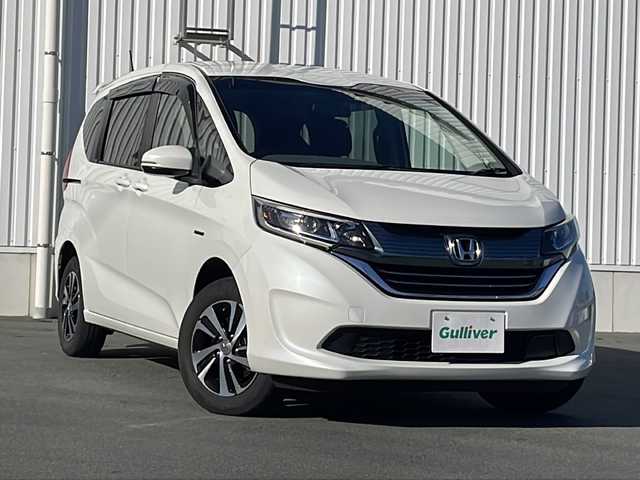 ホンダ フリード ハイブリット G ホンダセンシング 三重県 2017(平29)年 15.7万km ホワイトオーキッドパール 社外7型ナビ/ETC/バックカメラ/追従クルーズコントロール/レーンキープアシスト/前席シートヒーター/ステアリングアシスト/衝突軽減ブレーキ/LEDヘッドライト/LEDルームランプ/禁煙車