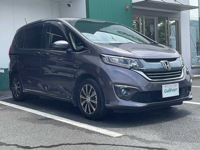 ホンダ フリード ハイブリット G ホンダセンシング 京都府 2018(平30)年 7.1万km モダンスティールM 純正メモリナビ　フルセグ　ＤＶＤ再生　Ｂｌｕｅｔｏｏｔｈオーディオ　バックカメラ　アダプティブクルーズコントロール　両側パワースライドドア　ＬＥＤヘッドライト　社外１５インチアルミ　ドライブレコーダー