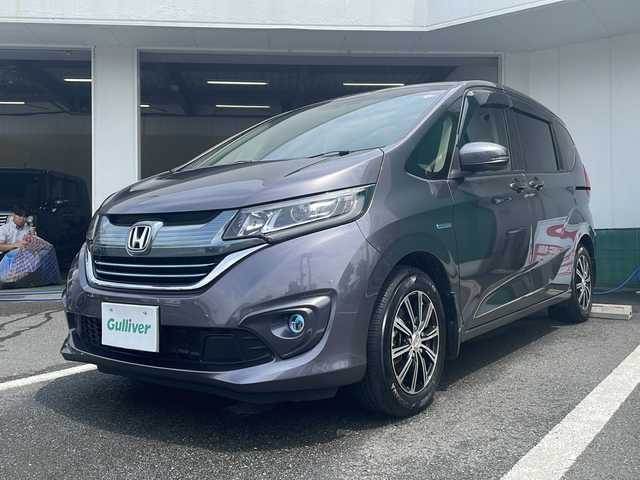 ホンダ フリード ハイブリット G ホンダセンシング 京都府 2018(平30)年 7.1万km モダンスティールM 純正メモリナビ　フルセグ　ＤＶＤ再生　Ｂｌｕｅｔｏｏｔｈオーディオ　バックカメラ　アダプティブクルーズコントロール　両側パワースライドドア　ＬＥＤヘッドライト　社外１５インチアルミ　ドライブレコーダー