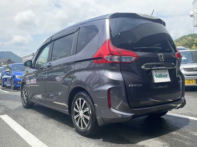ホンダ フリード ハイブリット G ホンダセンシング 京都府 2018(平30)年 7.1万km モダンスティールM 純正メモリナビ　フルセグ　ＤＶＤ再生　Ｂｌｕｅｔｏｏｔｈオーディオ　バックカメラ　アダプティブクルーズコントロール　両側パワースライドドア　ＬＥＤヘッドライト　社外１５インチアルミ　ドライブレコーダー
