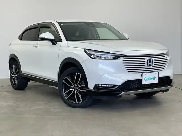 ホンダ ヴェゼル ハイブリッド e:HEV Z 新潟県 2023(令5)年 2.5万km プラチナホワイトパール 純正メモリナビ（Bluetooth・USB・AM・FM）/ハーフレザーシート　/バックカメラ　/フルセグ　/ETC2.0　/衝突被害軽減システム/レーンキープアシスト　/前後コーナーセンサー　/追従クルーズコントロール/前方ドライブレコーダー/LEDオートライト　/オートマチックハイビーム/前席シートヒーター/置くだけ充電　/パーキングアシスト/電動リアゲート/パドルシフト/ヒルディセントコントロール/ステアリングスイッチ/フロントワイパーデアイサー/４WD/純正フロアマット/純正１８インチアルミホイール/スマートキー/スペアキー
