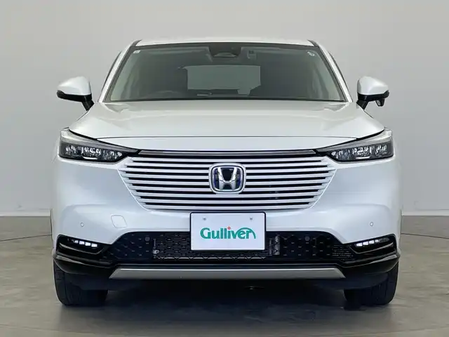 ホンダ ヴェゼル ハイブリッド e:HEV Z 新潟県 2023(令5)年 2.5万km プラチナホワイトパール 純正メモリナビ（Bluetooth・USB・AM・FM）/ハーフレザーシート　/バックカメラ　/フルセグ　/ETC2.0　/衝突被害軽減システム/レーンキープアシスト　/前後コーナーセンサー　/追従クルーズコントロール/前方ドライブレコーダー/LEDオートライト　/オートマチックハイビーム/前席シートヒーター/置くだけ充電　/パーキングアシスト/電動リアゲート/パドルシフト/ヒルディセントコントロール/ステアリングスイッチ/フロントワイパーデアイサー/４WD/純正フロアマット/純正１８インチアルミホイール/スマートキー/スペアキー