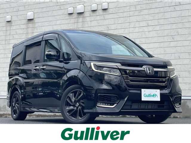 ホンダ ステップワゴン スパーダ クルスピセンシング 山形県 2020(令2)年 2.3万km プレミアムスパークルブラックパール 純正9型メモリーナビゲーション【VXM-227VFNi】/フルセグ　CD DVD　AM FM SD　MUSICRACK　USB　iPod　Bluetooth　/純正後席フリップダウンモニター【VM-185EN】/マルチビューカメラシステム/ブラックスタイル/わくわくゲート/両側電動スライドドア【サンシェード】/ホンダセンシング/CMBS衝突軽減ブレーキ/アダブティブクルーズコントロール/LKAS車線維持支援システム/路外逸脱抑制機能/誤発進抑制機能/先行車発進お知らせ機能/標識認識機能/歩行者事故低減ステアリング/ビルトインETC2.0/純正前後ドライブレコーダー/アイドリングストップ/革巻きステアリング/パドルシフト/プラズマクラスター付きトリプルゾーンオートエアコン/スポーツペダル/超高機能付LED式マップランプ/合皮コンビシート/前席シートバックテーブル/前席シートヒーター/プッシュスタート/スマートキー/LEDヘッドランプ/LEDフロントフォグランプ/オートライト/純正サイド/リアスポイラー/純正17インチアルミホイール/スペアキー