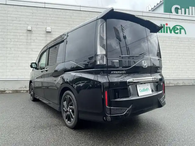 ホンダ ステップワゴン スパーダ クルスピセンシング 山形県 2020(令2)年 2.3万km プレミアムスパークルブラックパール 純正9型メモリーナビゲーション【VXM-227VFNi】/フルセグ　CD DVD　AM FM SD　MUSICRACK　USB　iPod　Bluetooth　/純正後席フリップダウンモニター【VM-185EN】/マルチビューカメラシステム/ブラックスタイル/わくわくゲート/両側電動スライドドア【サンシェード】/ホンダセンシング/CMBS衝突軽減ブレーキ/アダブティブクルーズコントロール/LKAS車線維持支援システム/路外逸脱抑制機能/誤発進抑制機能/先行車発進お知らせ機能/標識認識機能/歩行者事故低減ステアリング/ビルトインETC2.0/純正前後ドライブレコーダー/アイドリングストップ/革巻きステアリング/パドルシフト/プラズマクラスター付きトリプルゾーンオートエアコン/スポーツペダル/超高機能付LED式マップランプ/合皮コンビシート/前席シートバックテーブル/前席シートヒーター/プッシュスタート/スマートキー/LEDヘッドランプ/LEDフロントフォグランプ/オートライト/純正サイド/リアスポイラー/純正17インチアルミホイール/スペアキー