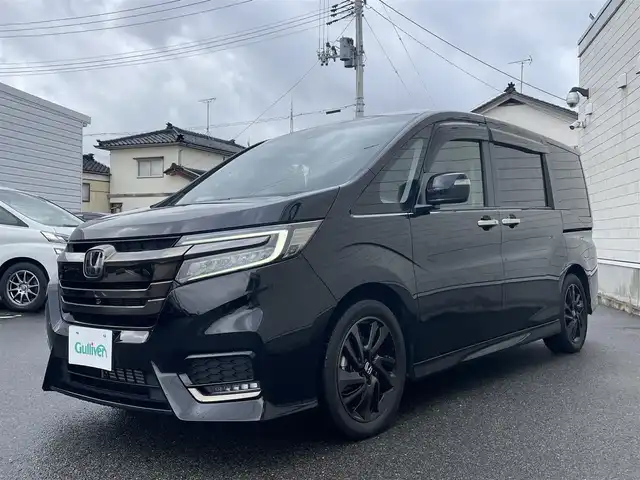 ホンダ ステップワゴン スパーダ クルスピセンシング 山形県 2020(令2)年 2.3万km プレミアムスパークルブラックパール 純正9型メモリーナビゲーション【VXM-227VFNi】/フルセグ　CD DVD　AM FM SD　MUSICRACK　USB　iPod　Bluetooth　/純正後席フリップダウンモニター【VM-185EN】/マルチビューカメラシステム/ブラックスタイル/わくわくゲート/両側電動スライドドア【サンシェード】/ホンダセンシング/CMBS衝突軽減ブレーキ/アダブティブクルーズコントロール/LKAS車線維持支援システム/路外逸脱抑制機能/誤発進抑制機能/先行車発進お知らせ機能/標識認識機能/歩行者事故低減ステアリング/ビルトインETC2.0/純正前後ドライブレコーダー/アイドリングストップ/革巻きステアリング/パドルシフト/プラズマクラスター付きトリプルゾーンオートエアコン/スポーツペダル/超高機能付LED式マップランプ/合皮コンビシート/前席シートバックテーブル/前席シートヒーター/プッシュスタート/スマートキー/LEDヘッドランプ/LEDフロントフォグランプ/オートライト/純正サイド/リアスポイラー/純正17インチアルミホイール/スペアキー