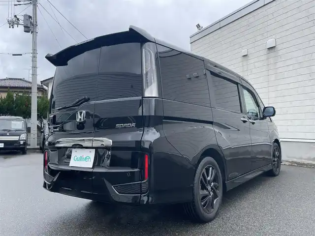 ホンダ ステップワゴン スパーダ クルスピセンシング 山形県 2020(令2)年 2.3万km プレミアムスパークルブラックパール 純正9型メモリーナビゲーション【VXM-227VFNi】/フルセグ　CD DVD　AM FM SD　MUSICRACK　USB　iPod　Bluetooth　/純正後席フリップダウンモニター【VM-185EN】/マルチビューカメラシステム/ブラックスタイル/わくわくゲート/両側電動スライドドア【サンシェード】/ホンダセンシング/CMBS衝突軽減ブレーキ/アダブティブクルーズコントロール/LKAS車線維持支援システム/路外逸脱抑制機能/誤発進抑制機能/先行車発進お知らせ機能/標識認識機能/歩行者事故低減ステアリング/ビルトインETC2.0/純正前後ドライブレコーダー/アイドリングストップ/革巻きステアリング/パドルシフト/プラズマクラスター付きトリプルゾーンオートエアコン/スポーツペダル/超高機能付LED式マップランプ/合皮コンビシート/前席シートバックテーブル/前席シートヒーター/プッシュスタート/スマートキー/LEDヘッドランプ/LEDフロントフォグランプ/オートライト/純正サイド/リアスポイラー/純正17インチアルミホイール/スペアキー