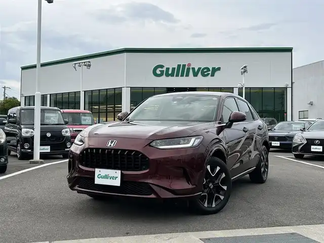 ホンダ ＺＲ－Ｖ ハイブリッド e:HEV Z 愛媛県 2022(令4)年 1.8万km ワイン 禁煙車/登録時走行距離:17952km/純正9型ナビ/フルセグTV/ハンズフリーパワーバックドア/全周囲カメラ/ビルトインETC2.0/アダプティブクルーズコントロール/コーナーセンサー/ホンダセンシング/・衝突軽減ブレーキ/・前後誤発進抑制機能/・車線維持支援システム/・先行車発進お知らせ機能/・標識認識機能/・オートハイビーム/・ブラインドスポットモニター/・後退出庫サポート/LEDヘッドランプ/革巻きステアリング/ステアリングヒーター/パドルシフト/本革シート/前席パワーシート/シートヒーター/運転席ポジションメモリー/純正18インチアルミホイール/スマートキーシステム