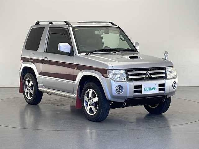 三菱 パジェロ ミニ エクシード 長野県 2008(平20)年 7.7万km クールシルバーM/ラズベリーレッドP 4WD/インタークーラーターボ/KEDWOOD RDT-1811DINオーディオ/(FM/AM/AUX/USB)/パワーステアリング/D+N席オートパワーウィンドウ/リモコンキー/AC/ドアバイザー/フェンダーミラー/トランスファ切替（2H/4H/4L）/ハロゲンヘッドライト/ハロゲンフォグ/ヘッドライトレベライザー/革巻きステアリング/純正フロアマット/純正15インチスタッドレス付きアルミホイール4本車載/純正マフラー車載/純正マッドガード/オートクルーズ製スロットルスペーサー/HKSリアピース/社外ダブルホーン/社外プラグコード/社外合皮シートカバー/社外センターコンソール/社外前後ドラレコ/社外フロントタワーバー/社外リアタワーバー/スペアキー×1