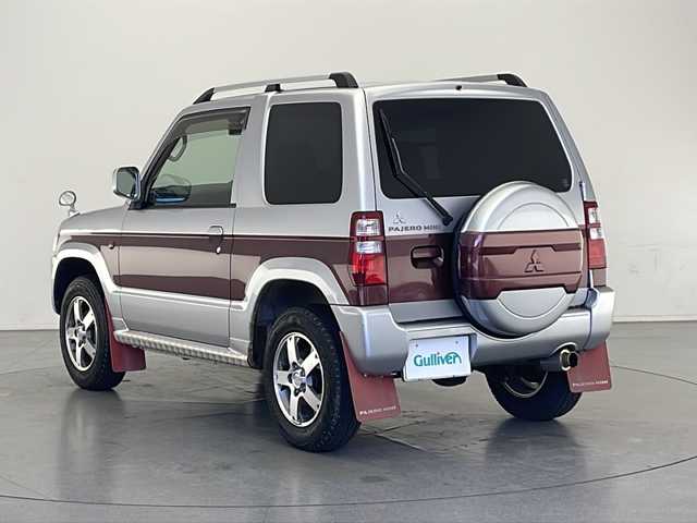 三菱 パジェロ ミニ エクシード 長野県 2008(平20)年 7.7万km クールシルバーM/ラズベリーレッドP 4WD/インタークーラーターボ/KEDWOOD RDT-1811DINオーディオ/(FM/AM/AUX/USB)/パワーステアリング/D+N席オートパワーウィンドウ/リモコンキー/AC/ドアバイザー/フェンダーミラー/トランスファ切替（2H/4H/4L）/ハロゲンヘッドライト/ハロゲンフォグ/ヘッドライトレベライザー/革巻きステアリング/純正フロアマット/純正15インチスタッドレス付きアルミホイール4本車載/純正マフラー車載/純正マッドガード/オートクルーズ製スロットルスペーサー/HKSリアピース/社外ダブルホーン/社外プラグコード/社外合皮シートカバー/社外センターコンソール/社外前後ドラレコ/社外フロントタワーバー/社外リアタワーバー/スペアキー×1