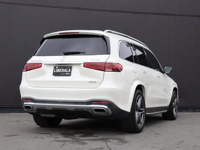 メルセデス・ベンツ ＧＬＳ４００ｄ 4マチック AMGライン 静岡県 2021(令3)年 4.3万km ダイヤモンドホワイト ●パノラミックスライディングルーフ/●MBUX(メルセデスユーザーエクスペリエンス)/12.3インチワイドディスプレイ/12.3インチコクピットディスプレイ/●Burmesterサラウンドサウンドシステム/●ワイヤレスチャージング/●本革シート/●ステアリングヒーター/●メモリー付パワーシート(前席)/●６ウェイパワーシート(２列目左右)/●電動ランバーサポート(前席)/●シートヒーター(全列左右)/●シートベンチレーター(前席)/●レザーARTICOダッシュボード/●温冷機能付カップホルダー(前席)/●アンビエントライト(64色)/●ヘッドアップディスプレイ/●エナジャイジングパッケージ/●エアバランスパッケージ(パフュームアドマイザー付)/●キーレスゴー/●フットトランクオープナー(テールゲート自動開閉機能)/●純正２１インチアルミホイール/●レーダーセーフティパッケージ/●３６０度カメラシステム/●パークトロニック/●アクティブパーキングアシスト(縦列・並列駐車)/●リアクロストラフィックアラート/●マルチビームLEDヘッドライト(ウルトラハイビーム付)/●アダプティブハイビームアシストプラス/●LEDコーナリングライト