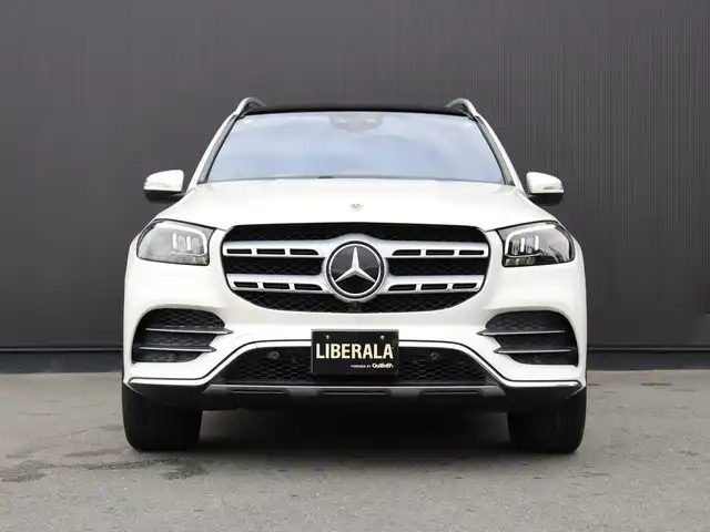 メルセデス・ベンツ ＧＬＳ４００ｄ 4マチック AMGライン 静岡県 2021(令3)年 4.3万km ダイヤモンドホワイト ●パノラミックスライディングルーフ/●MBUX(メルセデスユーザーエクスペリエンス)/12.3インチワイドディスプレイ/12.3インチコクピットディスプレイ/●Burmesterサラウンドサウンドシステム/●ワイヤレスチャージング/●本革シート/●ステアリングヒーター/●メモリー付パワーシート(前席)/●６ウェイパワーシート(２列目左右)/●電動ランバーサポート(前席)/●シートヒーター(全列左右)/●シートベンチレーター(前席)/●レザーARTICOダッシュボード/●温冷機能付カップホルダー(前席)/●アンビエントライト(64色)/●ヘッドアップディスプレイ/●エナジャイジングパッケージ/●エアバランスパッケージ(パフュームアドマイザー付)/●キーレスゴー/●フットトランクオープナー(テールゲート自動開閉機能)/●純正２１インチアルミホイール/●レーダーセーフティパッケージ/●３６０度カメラシステム/●パークトロニック/●アクティブパーキングアシスト(縦列・並列駐車)/●リアクロストラフィックアラート/●マルチビームLEDヘッドライト(ウルトラハイビーム付)/●アダプティブハイビームアシストプラス/●LEDコーナリングライト