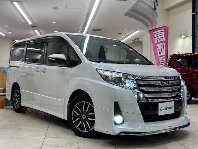 トヨタ ノア Si 東京都 2014(平26)年 3.6万km ホワイトパールクリスタルシャイン ワンオーナー/社外10インチナビ/(ALPINE/EX1000)/(CD/DVD/TVフルセグ/BT/HDMI)/バックカメラ/フリップダウンモニター/両側パワースライドドア/モデリスタエアロパーツ/スマートキー/プッシュスタート/オートライト/LEDライト/フォグランプ/ETC/純正フロアマット/ドライブレコーダー/（ZDR-014）/ISOFIX/革巻きステアリング/プライバシーガラス/アイドリングストップ/電動格納ウィンカーミラー/ドアバイザー/社外ツイーター/純正16インチアルミホイール/WSRS+ABS/横滑り防止装置/取扱説明書