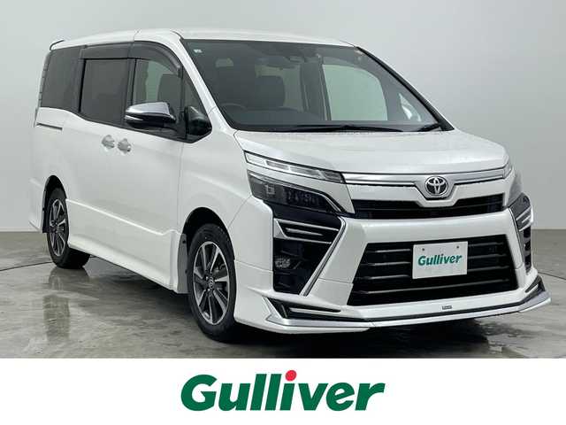 トヨタ ヴォクシー ZS 煌Ⅲ 大分県 2020(令2)年 3.1万km ホワイトパールクリスタルシャイン 禁煙車/純正9型SDナビ(フルセグTV/CD/DVD/BT)/バックカメラ/後席モニター/モデリスタエアロ/コーナーセンサー/トヨタセーフティーセンス/両側パワスラ/クルーズコントロール/ドライブレコーダー/ETC2.0/USB入力端子/LEDヘッドライト/純正フロアマット/純正16インチアルミホイール