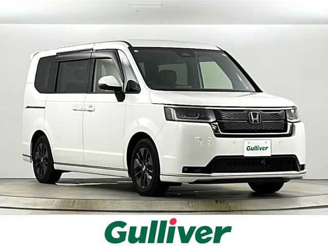 ホンダ ステップワゴン スパーダ 愛知県 2023(令5)年 0.6万km パール ワンオーナー/純正8インチナビ/（CD/DVD/Bluetooth/フルセグTV/USB/SD)/全方位カメラ/ホンダセンシング/・衝突軽減ブレーキ/・レーンキープアシスト/・オートマチックハイビーム/・ブラインドスポットモニター/・追従式クルーズコントロール/ETC/前後ドライブレコーダー/両側電動スライドドア/シートヒーター/オットマン/ＬＥＤヘッドライト/パドルシフト/電動リアゲート/スマートキー/純正アルミホイール