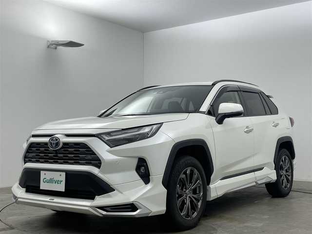 トヨタ ＲＡＶ４ ハイブリッドG 福岡県 2022(令4)年 2.9万km ホワイトパールクリスタルシャイン 純正９インチディスプレイオーディオ/（BT/USB/Carplay/IPod)/衝突軽減ブレーキ/全周囲カメラ/追従型クルーズコントロール/レーンキープアシスト/踏み間違い防止/コーナーセンサー/ブラインドスポットモニター/モデリスタ（前・横・後下）/ルーフレール/シートヒーター(運転席・助手席）/エアシート（運転席・助手席）/電動リアゲート/ステアリングヒーター/ドライブレコーダー（前・後）/パワーシート/電動リアゲート/ＬＥＤヘッドライト/オートハイビーム/オートライト/フォグランプ/プッシュスタート/ビルトインＥＴＣ/スマートキー×1/アイドリングストップ/純正フロアマット/純正18インチAW/ISOFIX/ステアリングスイッチ/チルトステアリング/シートリフター/ウインカーミラー/ドアバイザー/新車保証書/取扱説明書/スペアキー×１