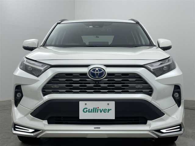トヨタ ＲＡＶ４ ハイブリッドG 福岡県 2022(令4)年 2.9万km ホワイトパールクリスタルシャイン 純正９インチディスプレイオーディオ/（BT/USB/Carplay/IPod)/衝突軽減ブレーキ/全周囲カメラ/追従型クルーズコントロール/レーンキープアシスト/踏み間違い防止/コーナーセンサー/ブラインドスポットモニター/モデリスタ（前・横・後下）/ルーフレール/シートヒーター(運転席・助手席）/エアシート（運転席・助手席）/電動リアゲート/ステアリングヒーター/ドライブレコーダー（前・後）/パワーシート/電動リアゲート/ＬＥＤヘッドライト/オートハイビーム/オートライト/フォグランプ/プッシュスタート/ビルトインＥＴＣ/スマートキー×1/アイドリングストップ/純正フロアマット/純正18インチAW/ISOFIX/ステアリングスイッチ/チルトステアリング/シートリフター/ウインカーミラー/ドアバイザー/新車保証書/取扱説明書/スペアキー×１