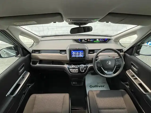 ホンダ フリード ハイブリット G ホンダセンシング 福岡県 2021(令3)年 4.9万km スーパープラチナグレーメタリック 純正7型SDナビ(フルセグTV/CD/DVD/BT)ホンダセンシングバックカメラ両側パワスラレーダークルコンETCUSB純正フロアマット純正LEDプッシュスタートスマートキースペアキー
