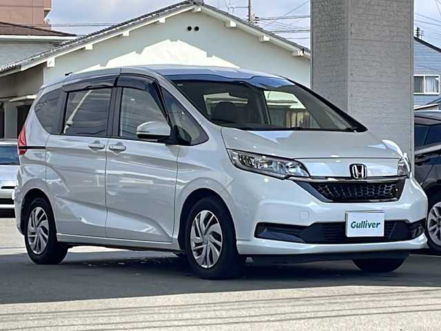 ホンダ フリード G ホンダセンシング 愛媛県 2020(令2)年 6.2万km プラチナホワイトパール ホンダセンシング/ワンオーナー /純正ディーラーOPナビ/フルセグTV/Bluetooth/DVD再生可能/両側パワースライドドア/ビルトインETC/前席シートヒーター/レーダークルーズコントロール/バックカメラ/スペアキーX1/取扱説明書