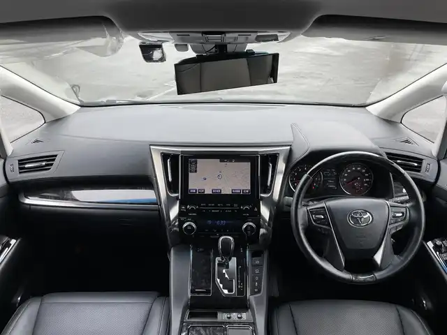 トヨタ アルファード SC 道央・札幌 2018(平30)年 1.6万km ブラック ４WD/JBLプレミアムサウンドシステム/純正ディーラーOPナビ/CD/DVD/BT/フルセグ/純正フリップダウンモニター/トヨタセーフティセンス/プリクラッシュセーフティ/横滑り防止装置/レーダークルーズコントロール/レーンキープアシスト/パーキングアシスト/クリアランスソナー/ブラインドスポットモニター/パーキングサポートブレーキ/バックカメラ/ビルトインETC2.0/ドライブレコーダー/アイドリングストップ/両側パワースライドドア/パワーバックドア/前席/２列目パワーシート/前席シートヒーター/前席エアシート/D席メモリーシート/N席/２列目オットマン/ステアリングリモコン/ハンドルヒーター/AC100V/自動防眩ミラー/電動パーキング/ブレーキホールド/MTモード付AT/プッシュスタート/スマートキー/純正リモートスタート/LEDヘッドライト/オートライト/オートハイビーム/フォグランプ/電動格納ミラー/ウィンカーミラー/純正フロアマット/ドアバイザー/スペアキー